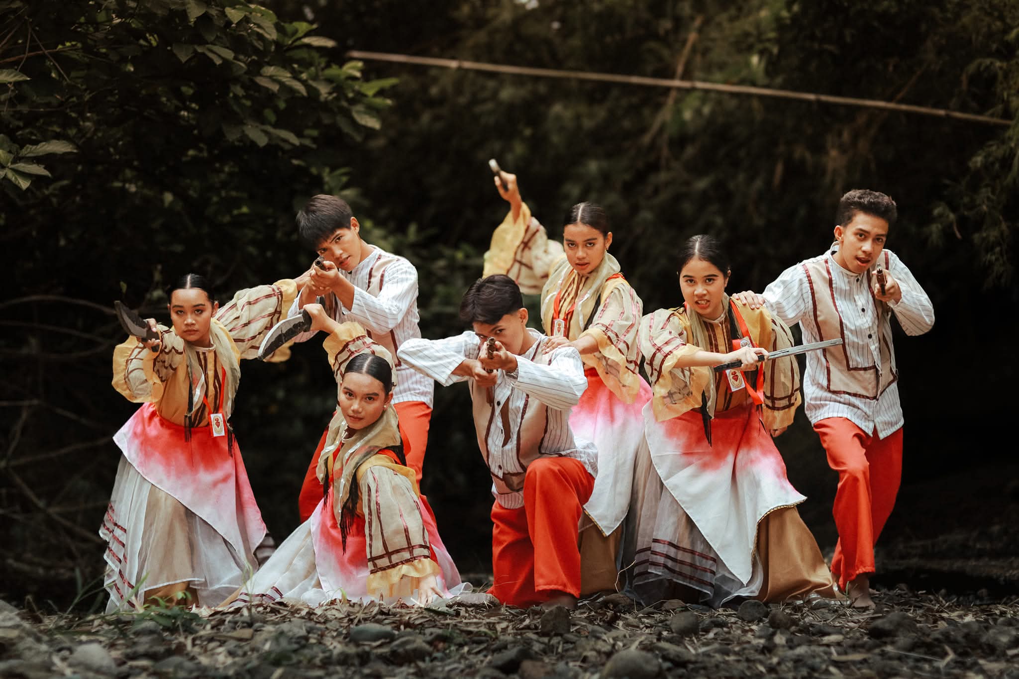 Cry of Jelicuon troupe in a synchronized forward charge stance, blades extended.