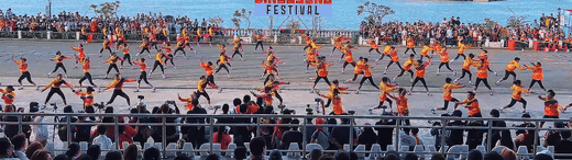 Cry of Jelicuon performers in wide planted lunges thrusting against the ground