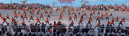 Cry of Jelicuon performers driving forward in synchronized directional movement